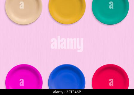 Colored Empty ceramic round plates isolated on white background Stock Photo