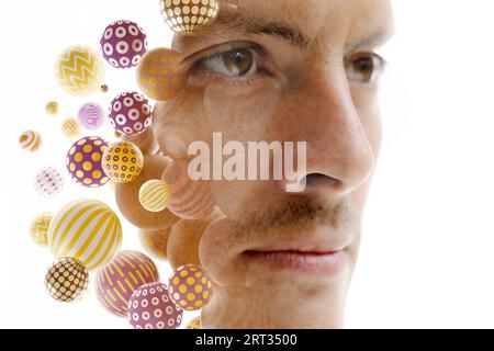 A double exposure male portrait combined with 3D spheres on white background Stock Photo