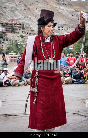Ladakh, India, September 4, 2018: Elderly woman in traditional costume performing dance on festival in Ladakh. Illustrative editorial Stock Photo