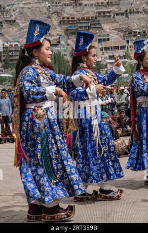 Ladakh, India, September 4, 2018: Group of women in traditional costumes dancing and singing on festival in Ladakh. Illustrative editorial Stock Photo