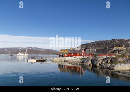Rodebay, Greenland, July 08, 2018: Resturant H8 in at the small harbor. Rodebay, also known as Oqaatsut is a fishing settlement north of Ilulissat Stock Photo
