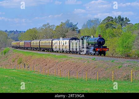 New build GWR Saint Class 4-6-0  Steam Locomotive No. 2999 Lady of Legend is seen with a period passenger train just after leaving Bewdley SVR. Stock Photo