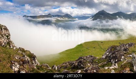 Panorama of spectacular mountains and fjords near the village of Funningur from the Hvithamar mountain in Faroe Islands, Denmark. Stock Photo