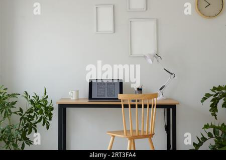 Mobile app wireframe on laptop screen on desk in home office Stock Photo