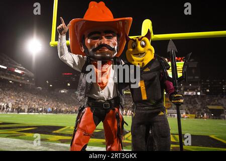 Oklahoma State mascot “Pistol Pete” and Arizona State mascot “Sparky” pose for a photo in the fourth quarter of a game at Mountain America Stadium on Stock Photo