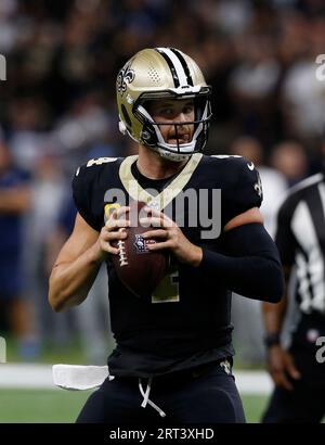 New Orleans Saints quarterback Derek Carr throws a pass against the  Tennessee Titans during the first half of an NFL football game Tuesday, Sept.  12, 2023, in New Orleans. (AP Photo/Butch Dill