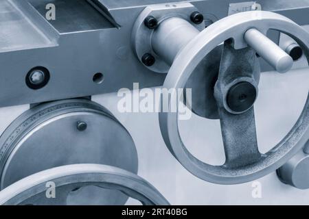 Lathe control knobs close up blue tone. Metal machine tools industry. The metalworking process by turning machine. industry metal processing concept Stock Photo