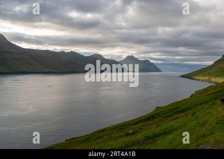 Trollanes village on Kalsoy island seen from Kunoy Island, Faroe Islands Stock Photo