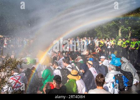 The Hague, South Holland, Netherlands. 9th Sep, 2023. Dutch police spray climate activists with water cannons. On 9 September, 2023, Extinction Rebellion activists blocked the A12 Highway running through the center of The Hague, The Netherlands. The protest was in opposition to the Dutch government's billions of euros in subsidies to the fossil fuel industry. (Credit Image: © James Petermeier/ZUMA Press Wire) EDITORIAL USAGE ONLY! Not for Commercial USAGE! Stock Photo