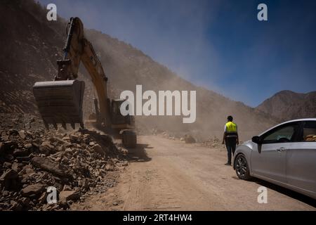 Marrakech, Morocco. 10th Sep, 2023. A tractor clears the road in the mountains to allow traffic and ambulance to pass through. More than 2,100 people are killed in powerful earthquake near Marrakech, Morocco. Despite local and international effort, the mountain areas which are most hit by the earthquake which results into a great problem for rescue mission and humanitarian assistance. Many villages have been cut out of electricity and running water. (Photo by Ashley Chan/SOPA Images/Sipa USA) Credit: Sipa USA/Alamy Live News Stock Photo