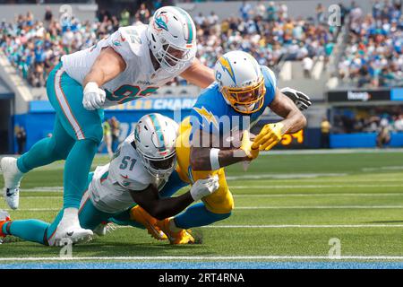 Miami Dolphins defensive tackle Zach Sieler (92) and Cleveland Browns guard Wyatt  Teller (77) exchange jerseys at the end of an NFL football game, Sunday,  Nov. 13, 2022, in Miami Gardens, Fla.