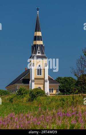 St Patricks Catholic Church in summer with wildflowers, Grand River, Prince Edward Island, Canada Stock Photo