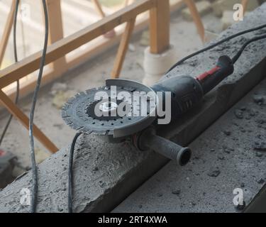 Circular saw with a diamond blade at a construction site.  Stock Photo