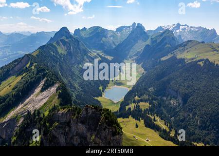 Sämtisersee is an Alpine lake between the mountains as seen from Hoher Kasten Mountain in Switzerland's Appenzell Alps near Altstätten, Switzerland. Stock Photo