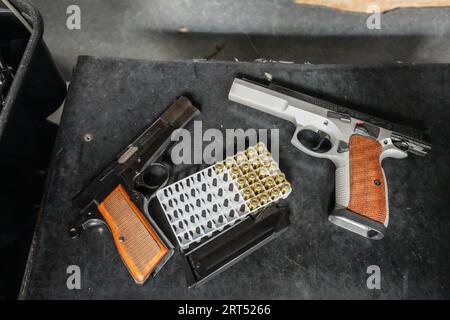 Los Angeles, United States. 09th Sep, 2023. Handguns and bullets are seen on the table of the shooting room. Even though there are many voices objecting the gun violence, owning gun is still legal for every American in the United States. Everyday, a lot of people come over and do gun trainings at The Los Angeles Gun Club located in Los Angeles, California.This gun club is open to public, including people who travel to the United States from other countries. Also, this gun clubs sells different types of guns to the eligible California residents. Credit: SOPA Images Limited/Alamy Live News Stock Photo