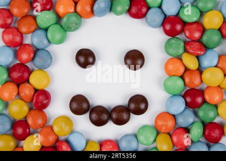 pile of colorful chocolate candies with a smile made of candy Stock Photo