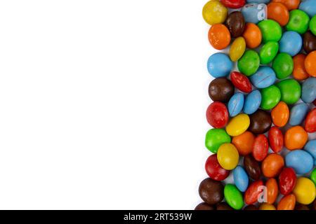 pile of colorful chocolate candies on white background, top view Stock Photo