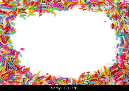 Frame made of colorful sprinkles on white background, top view. Confectionery decoration Stock Photo
