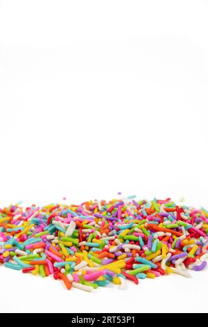 colorful sugar sprinkles on white background Stock Photo