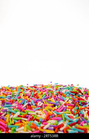 colorful sugar sprinkles on white background Stock Photo
