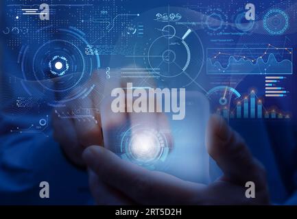 Man holds futuristic virtual mobile phone. Virtual interface, augmented reality and global communication network concept Stock Photo