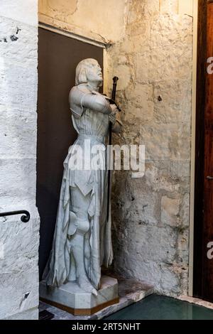 Statue of military leader and heroine Joan d'Arc, patron saint of France, in Historial Jeanne d'Arc museum, Rouen city center, France Stock Photo