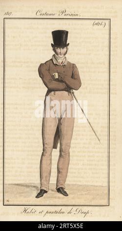 French gentleman in top hat, wool coat and trousers, holding a cane. Habit et pantalon du Drap. Handcoloured copperplate engraving by Pierre-Charles Baquoy after a fashion plate by Horace Vernet from Pierre de la Mesangere’s Journal des Dames et des Modes, Magazine of Women and Fashion, Paris, 1817. Stock Photo