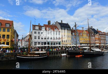 Colourful façades and old ships along the Nyhavn Canal in Copenhagen, Denmark. Stock Photo