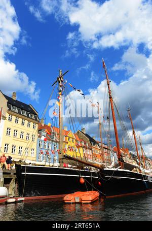 Colourful façades and old ships along the Nyhavn Canal in Copenhagen, Denmark. Stock Photo