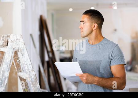 Architect making notes for space planning Stock Photo