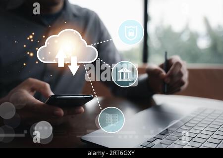 Virtual screen with cloud computing diagram displayed by a man Stock Photo