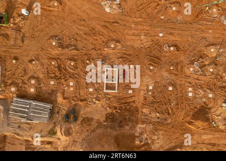 Drone photography of a large construction site with lots of machinery during summer day Stock Photo