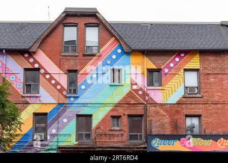 Toronto, Canada, is an old building decorated with rainbow colors in the Gay Village. Stock Photo