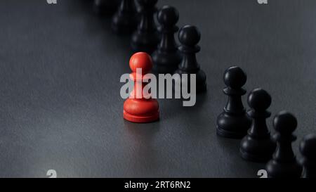 The concept of leadership, the white pawn piece stands out from the crowd of black.3D rendering on black background. Stock Photo