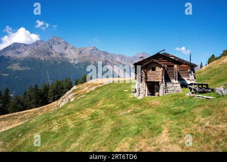 Mountain huts photographed in the Valtellina pastures near Bormio Stock Photo