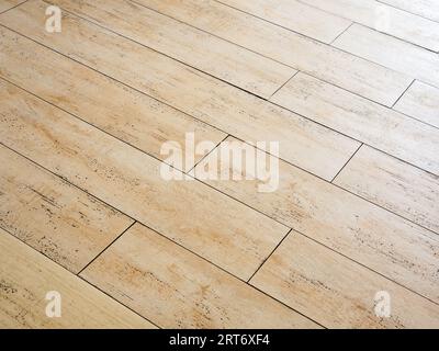 Brown wooden pavement floor design in the house, rubber tile, realistic wooden pattern surface. Abstract wood grain rubber flooring tile texture mater Stock Photo