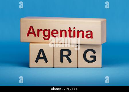 Argentina and ARG symbol. Concept words Argentina and ARG on wooden blocks.  English name and abbreviation of country name. Copy space.3D rendering on Stock Photo