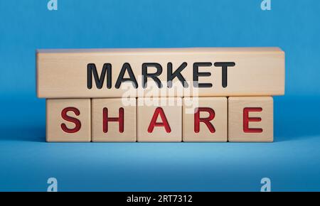 Market Share News symbol. Wooden blocks with words 'Market Share'. Wooden cube blocks. Copy space.3D rendering on blue background. Stock Photo