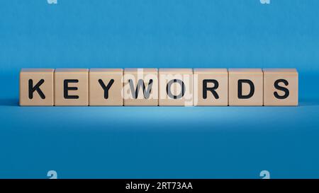 Seo keywords - text concept on wooden cubes.3D rendering on blue background. Stock Photo