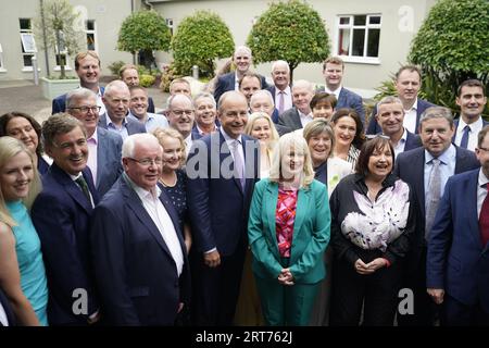 Tanaiste Micheal Martin (centre) with Fianna Fail colleagues before a Fianna Fail party event at the Horse and Jockey Hotel in Thurles, Co. Tipperary. Picture date: Monday September 11, 2023. Stock Photo