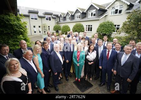 Tanaiste Micheal Martin (centre) with Fianna Fail colleagues before a Fianna Fail party event at the Horse and Jockey Hotel in Thurles, Co. Tipperary. Picture date: Monday September 11, 2023. Stock Photo