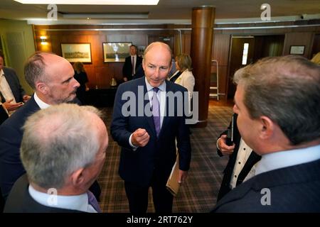 Tanaiste Micheal Martin (centre) during a Fianna Fail party event at the Horse and Jockey Hotel in Thurles, Co. Tipperary. Picture date: Monday September 11, 2023. Stock Photo