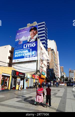 La Paz, BOLIVIA; September 11th 2023: A hoarding with Bolivian president Luis Arce Catacora promoting the 'Industrialisation of lithium, a big step towards a sustainable future for Bolivia' overlooks the Plaza del Bicentenario in central La Paz. Bolivia has some of the world's largest lithium reserves in the Salar de Uyuni salt flat, the development of which is central to the govenrnment's economic policy. This year Bolivia has signed agreements with the Chinese battery maker CATL and the Citic Guoan Group, and the Russian state firm Rosatom, as partners to develop these resources. Stock Photo