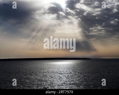 Morning light over St Ann's Head from Skokholm, Pembrokeshire, Wales Stock Photo