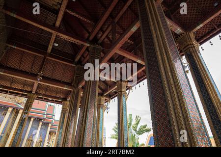 Close up to the artistic architecture and decoration of Phra Ubosot or The Chapel of The Emerald Buddha or Wat Phra Kaew, The Grand Palace, Thailand - Stock Photo