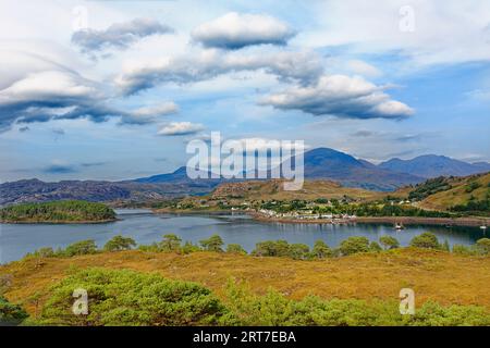 Shieldaig Sutherland Scotland looking across the Loch to the village houses and hills in summer Stock Photo