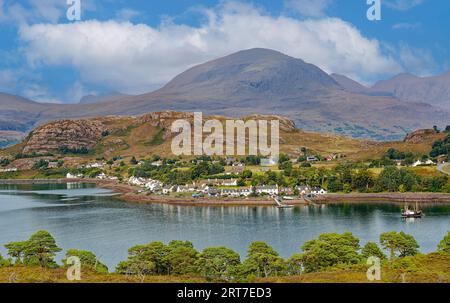 Shieldaig Sutherland Scotland looking across the Loch to village houses and hills in summer Stock Photo