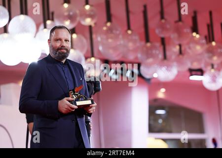 VENICE, ITALY - Sep 09: Yorgos Lanthimos poses with the Golden Lion for Best Film for 'Poor Things' at the winner's photocall at the 80th Venice International Film Festival on September 09, 2023 in Venice, Italy..(Photo by Mark Cape/Insidefoto) Stock Photo