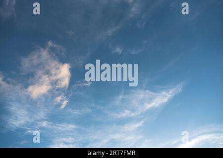 Bright sky in daylight with floating clouds. Stock Photo