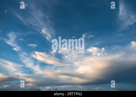 Bright sky in daylight with floating clouds. Stock Photo